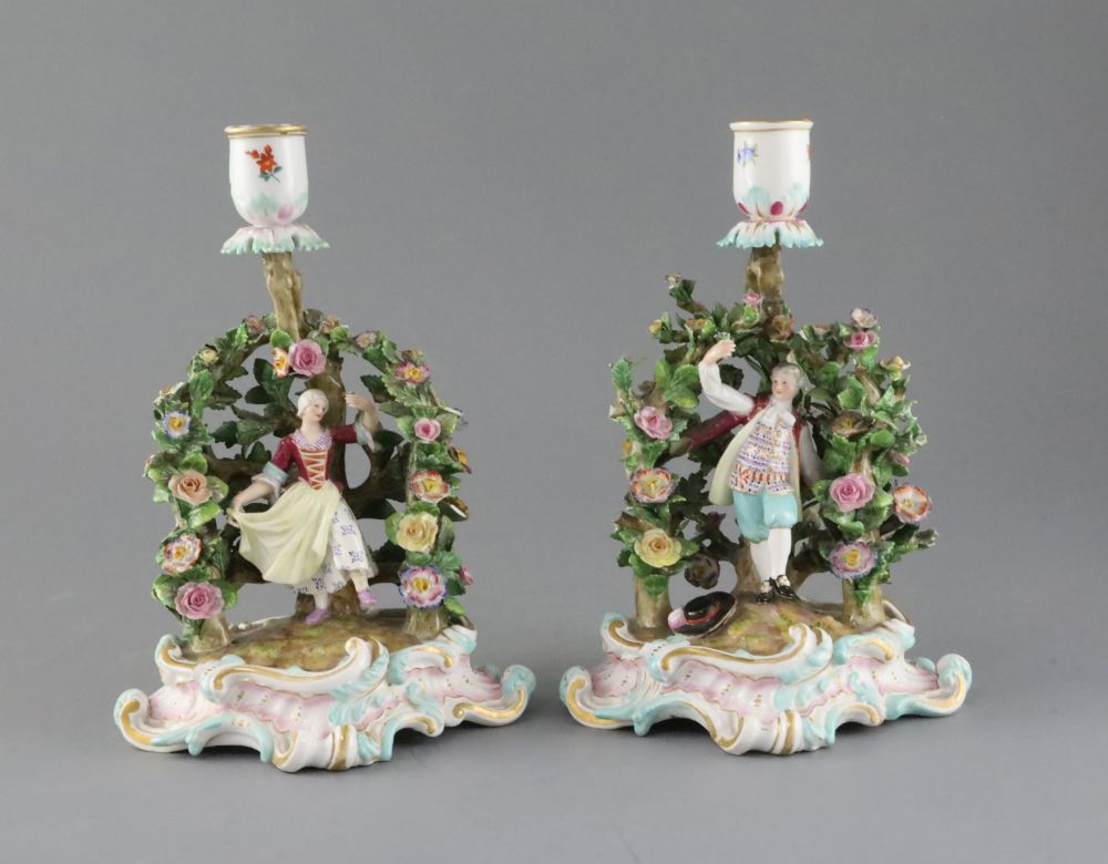 A pair of Meissen figural candlesticks, late 19th century, H.12cm